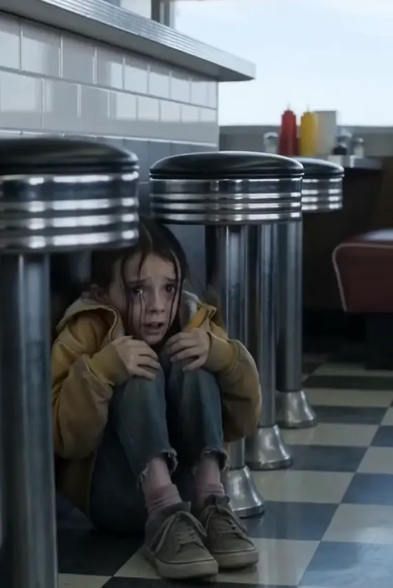 A little girl crawled under a diner counter and whispered five words that would change everything.