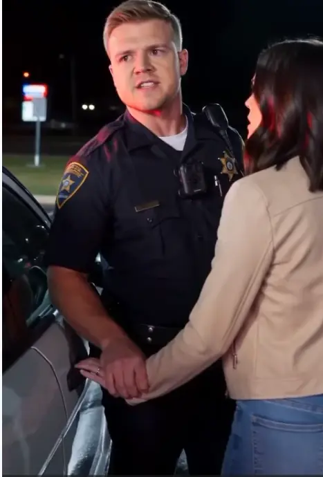 The Officer Who Said She Could Leave Only When He Allowed It. The Stranger in the Charcoal Jacket Knew the Real Reason She Had Been Stopped.